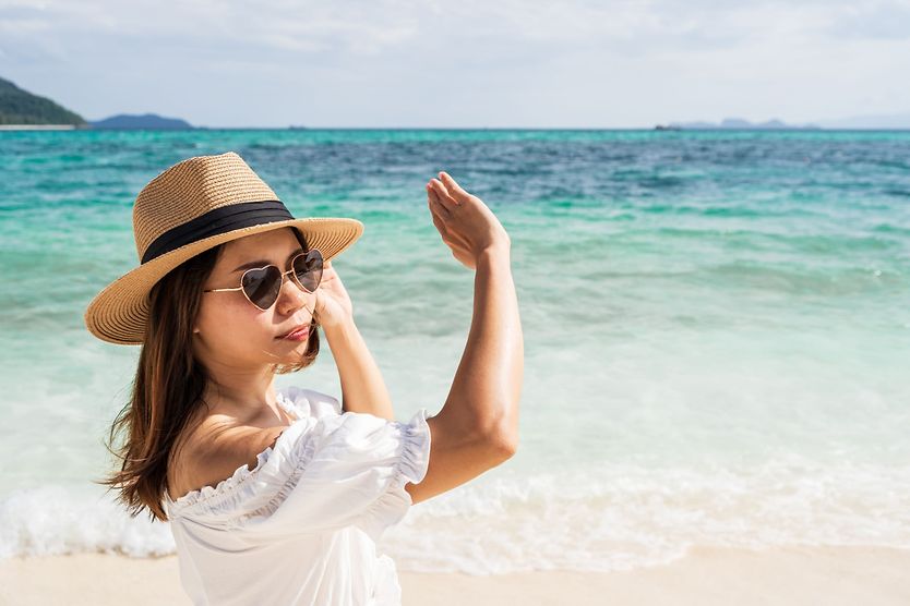 Can you put progressive lenses in sunglasses? woman wearing uv protected sunglasses shielding her eyes from sun
