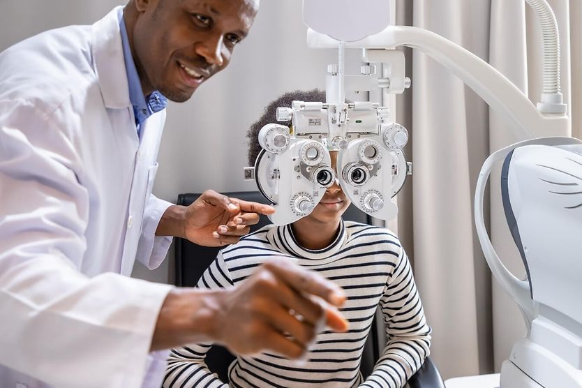 Doctor giving eye exam. Doctor giving eye exam to a young patient.