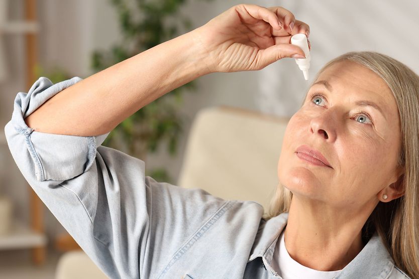 What is an ophthalmic solution and who needs it? person putting ophthalmic solution into eye