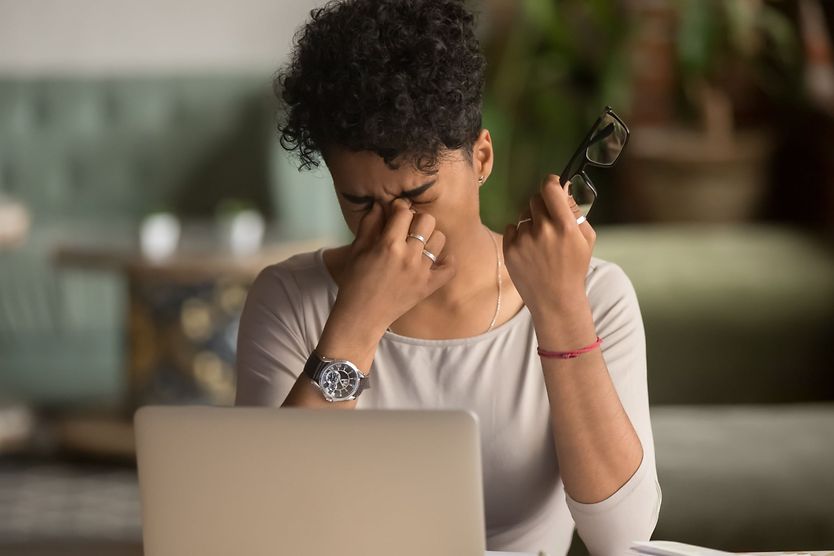 woman at computer with tired eyes