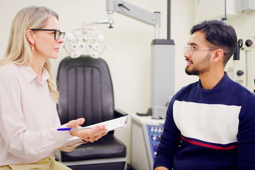 Eye Doctor talking with patient