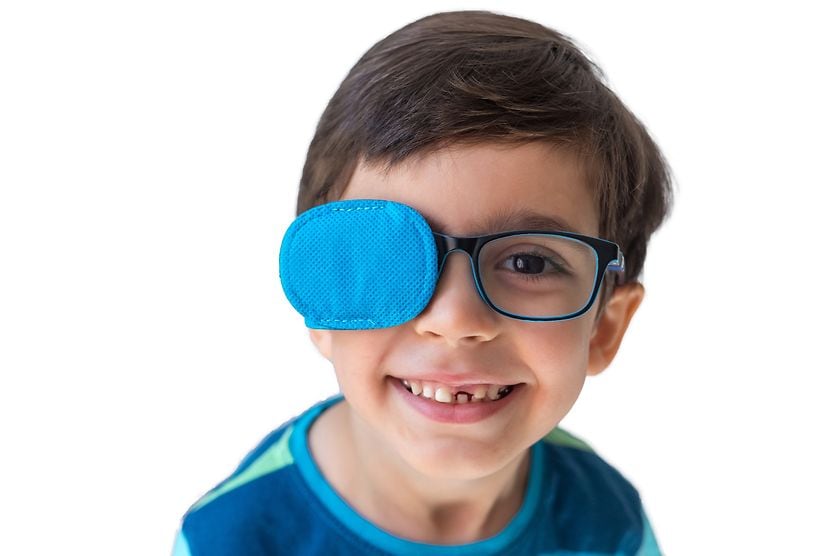 boy wearing eye patch