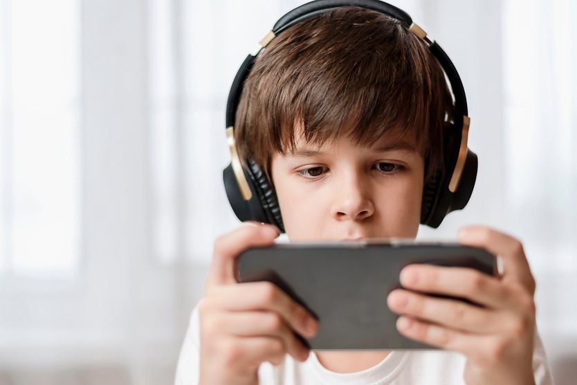 How to help children avoid computer vision syndrome child playing game on tablet computer