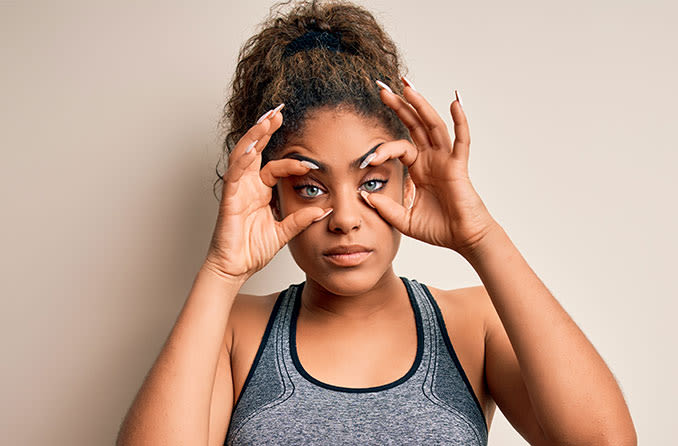 woman doing eyelid exercises to help with her drooping eyelids