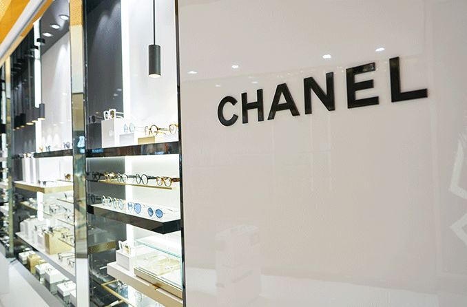 Chanel glasses behind a retail store window