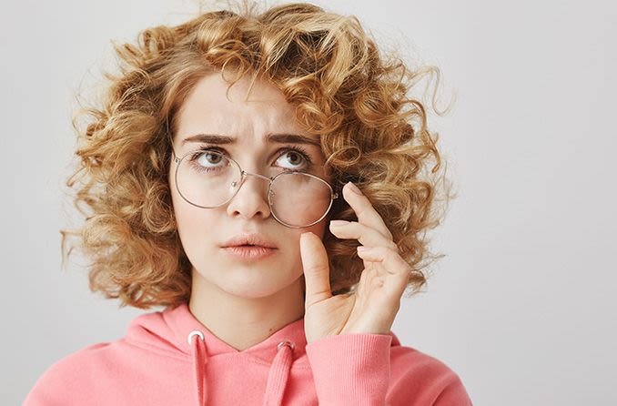 Woman unhappy with her eyeglasses that don't fit