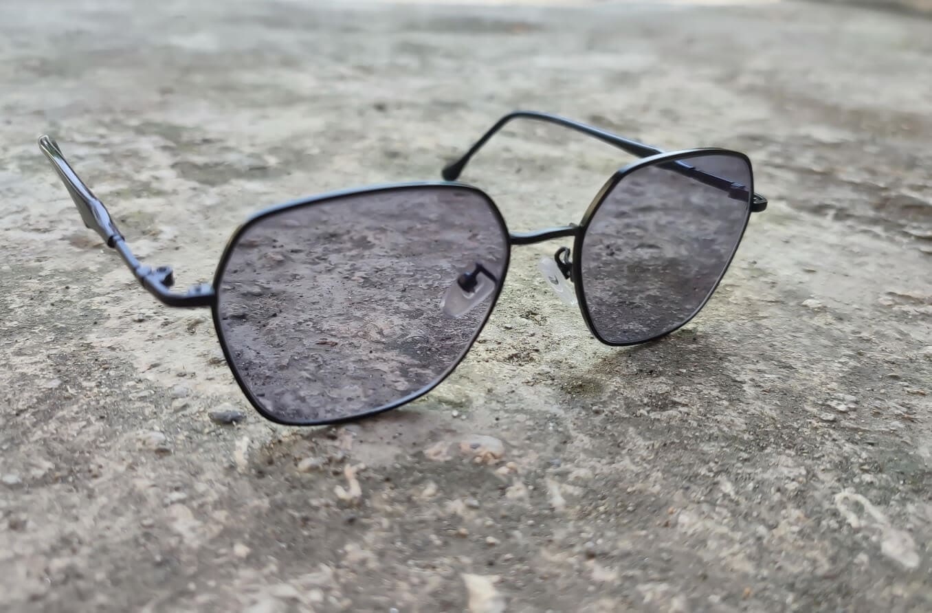 Photochromic lenses on concrete.