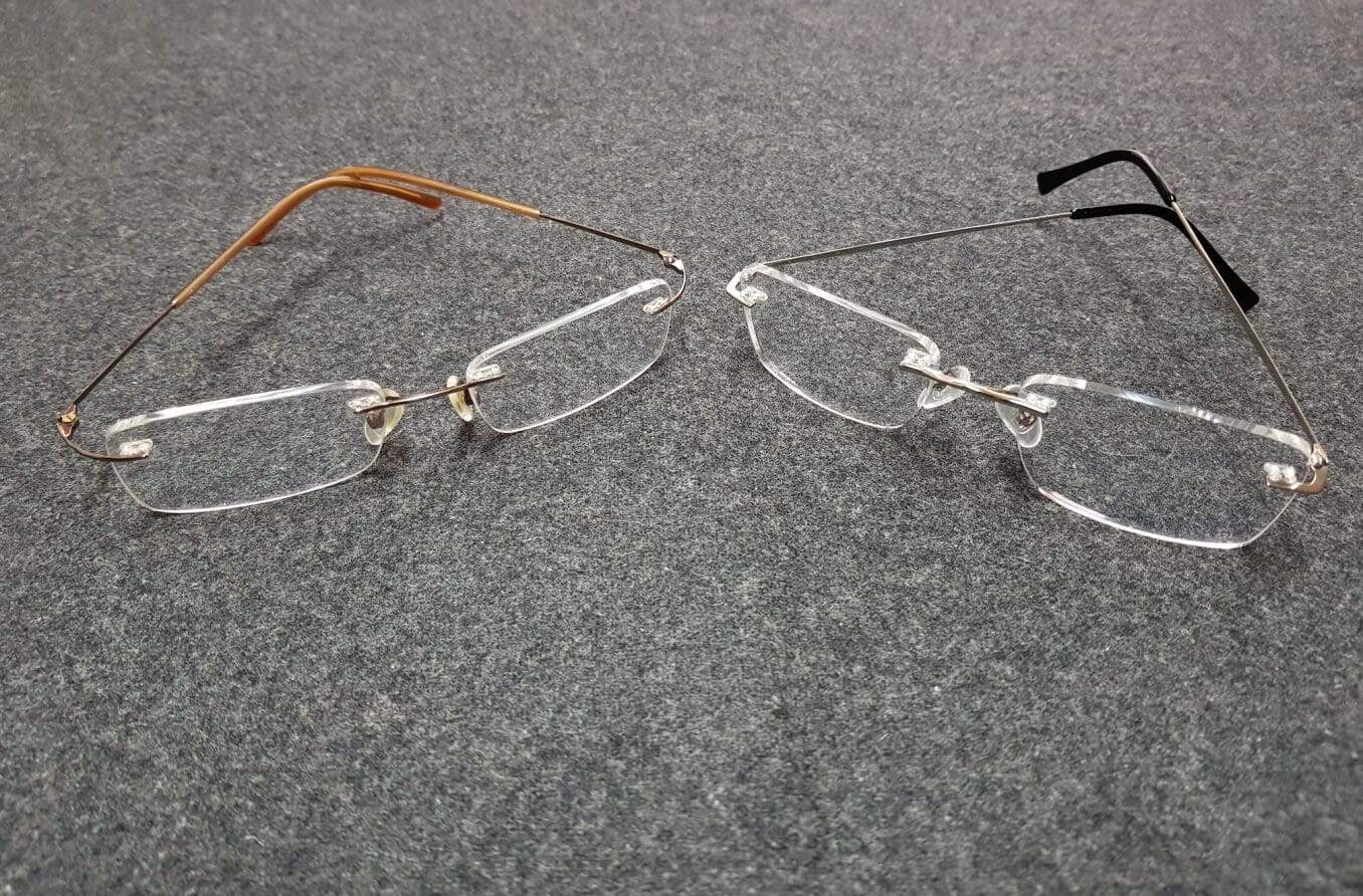 Two sets of glasses sitting on a counter.