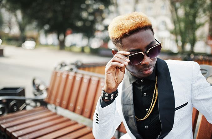 African American male wearing designer sunglasses