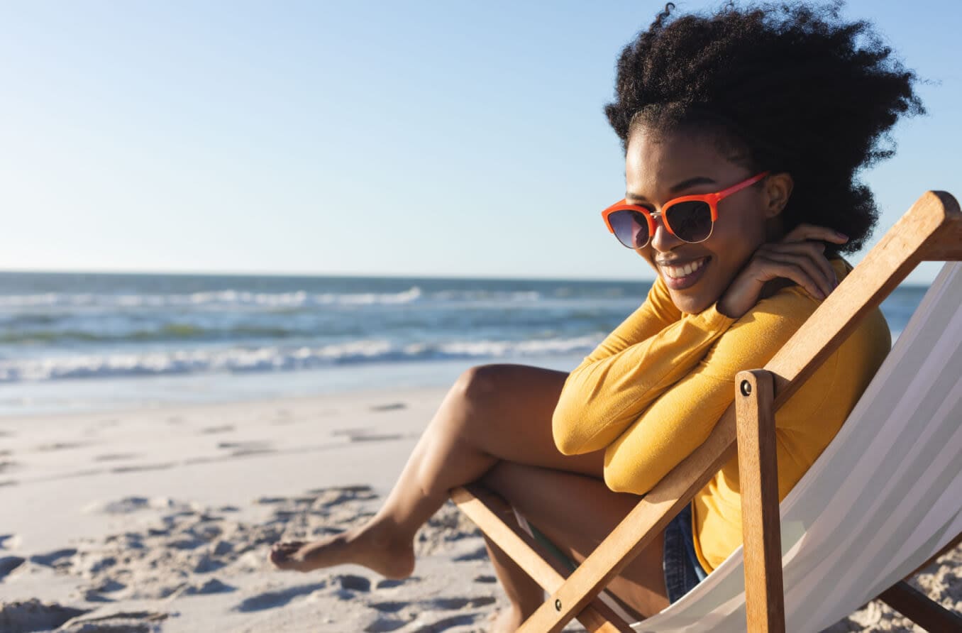 Woman wearing sunglasses on the beach