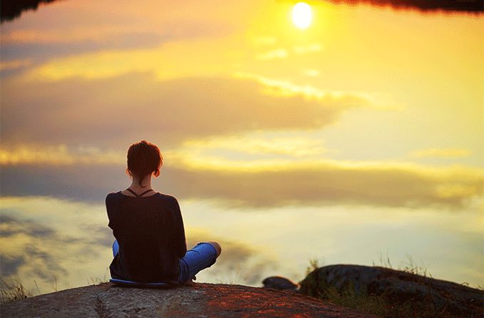 woman practicing sun gazing