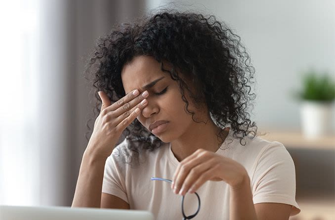 woman at computer with tired eyes