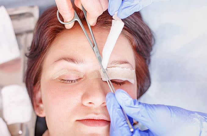 woman getting treatment for her drooping eyelids (ptosis)