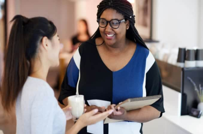 two women having a conversation and making eye contact