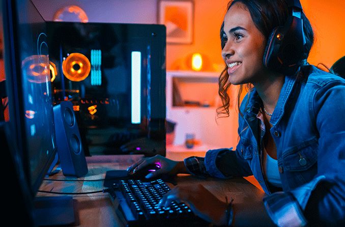 girl playing video games staring at the screen