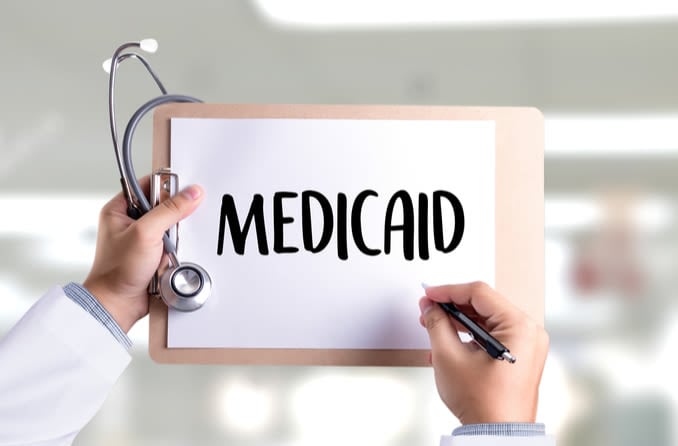 Medicaid written on a clipboard