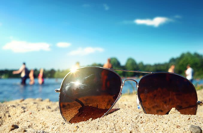 Sunglasses with uv protection lying in the sand