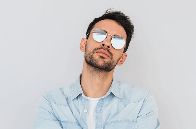 man wearing mirrored sunglasses