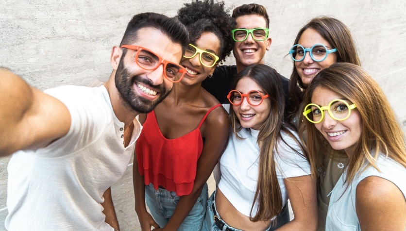 A group of young adults wearing glasses for myopia as an example of how common nearsightedness is.