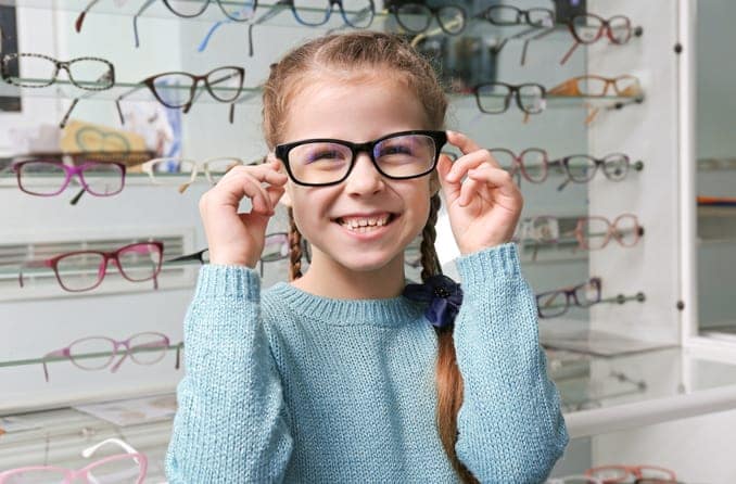 girl in glasses shop