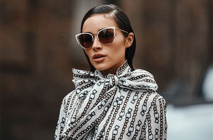 woman wearing designer sunglasses