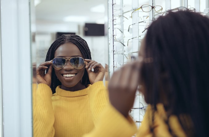 woman buying sunglasses