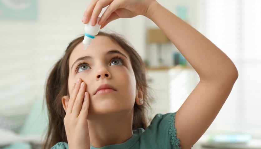 How can eye drops improve vision for children with myopia?