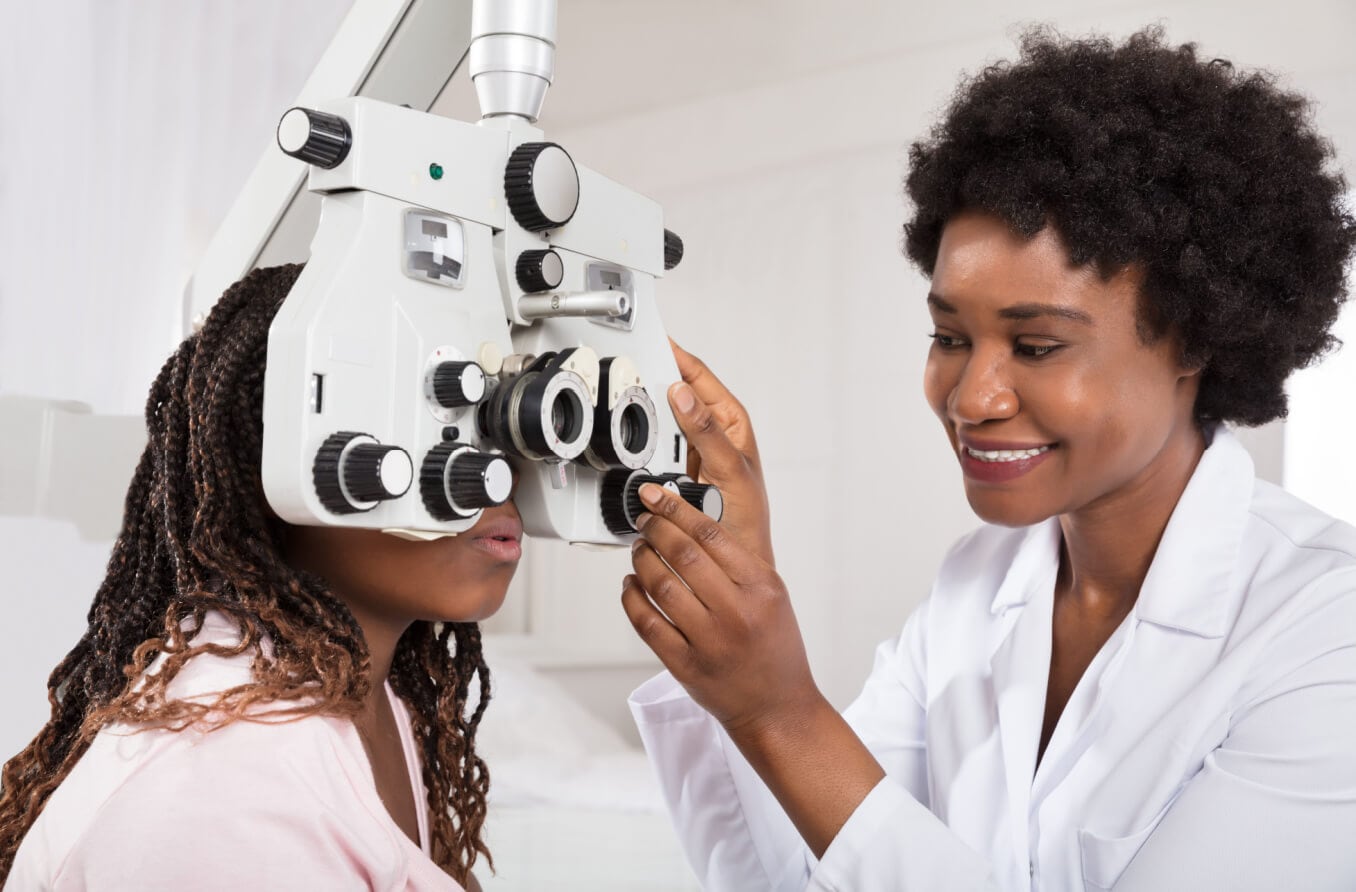 Optometrist sight testing for a patient.