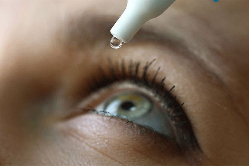 closeup of an eye getting treated with lumify eye drops