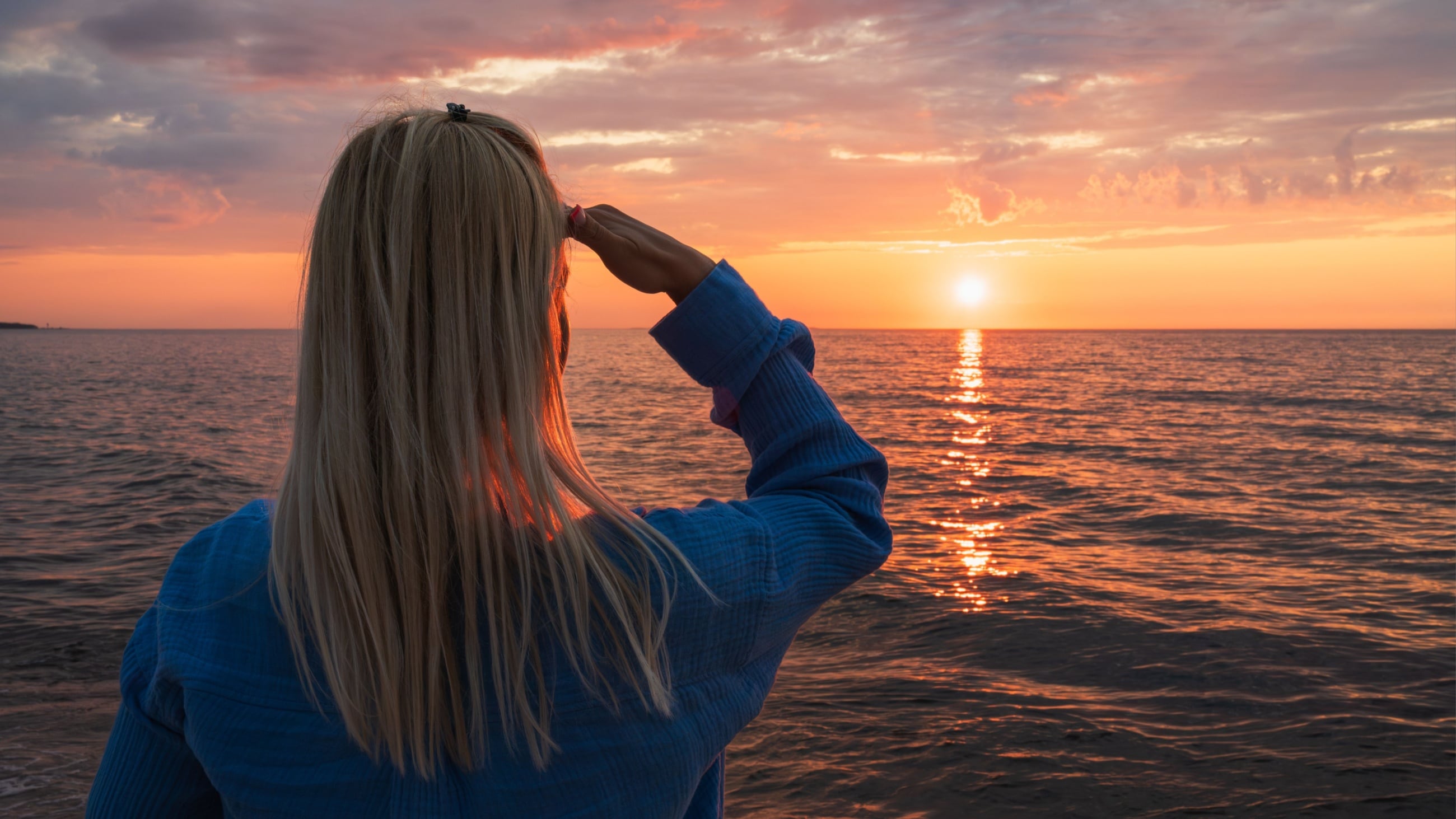 woman looking at the sun