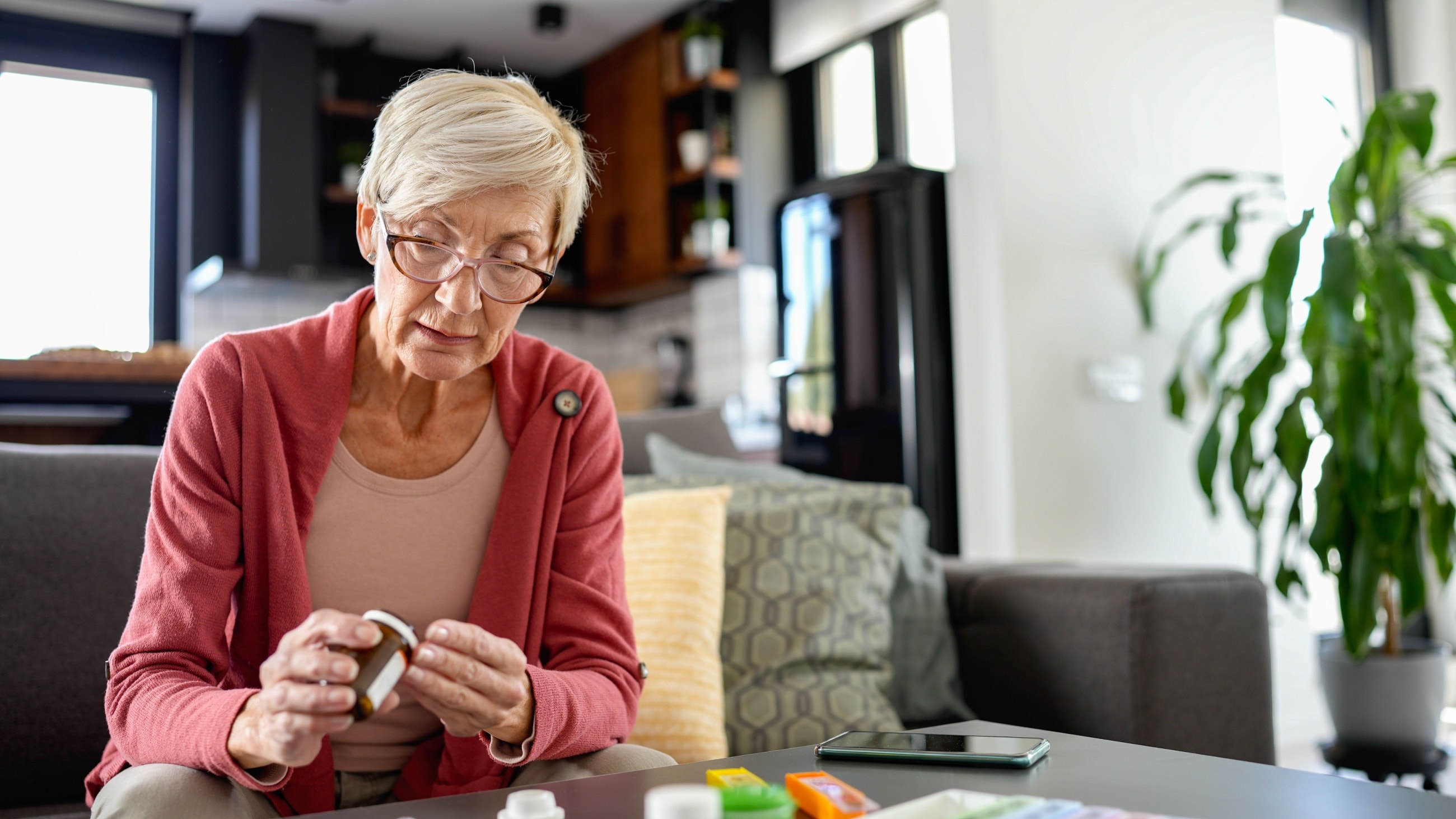 woman checking medications