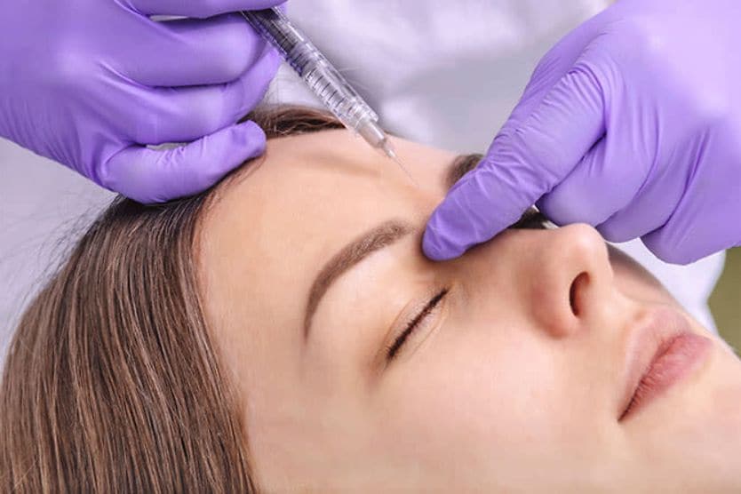 woman getting botulinum toxin injections