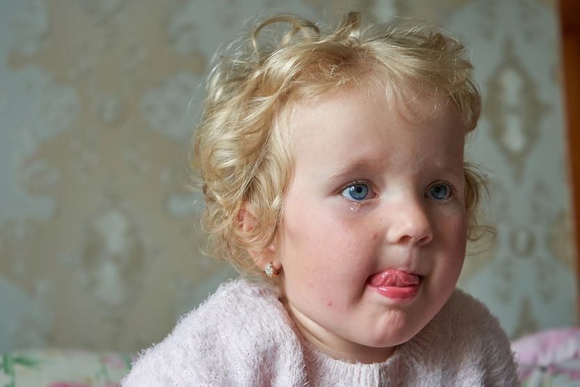 little girl licking her salty tears