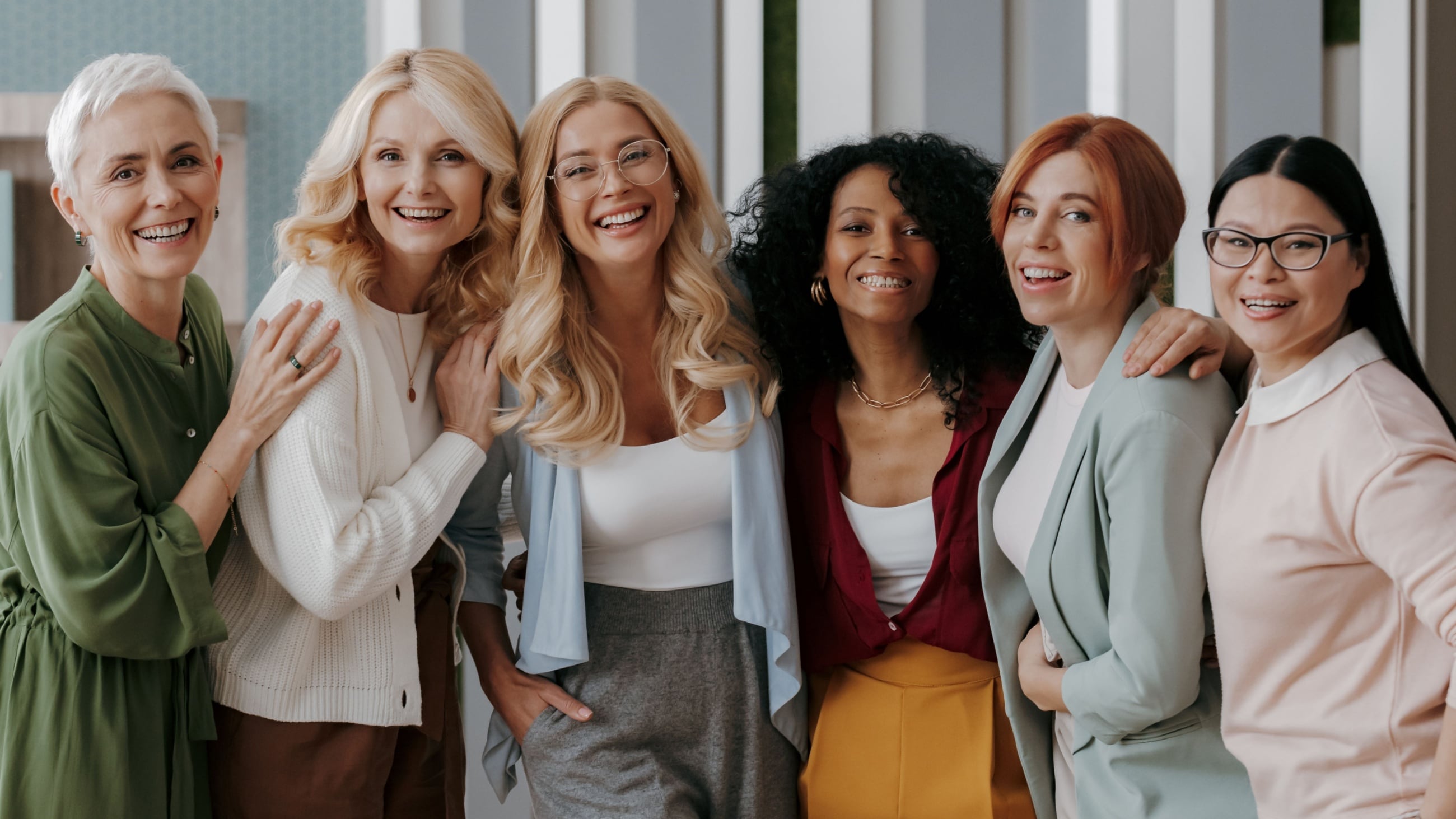 group of women of all ages laughing and smiling