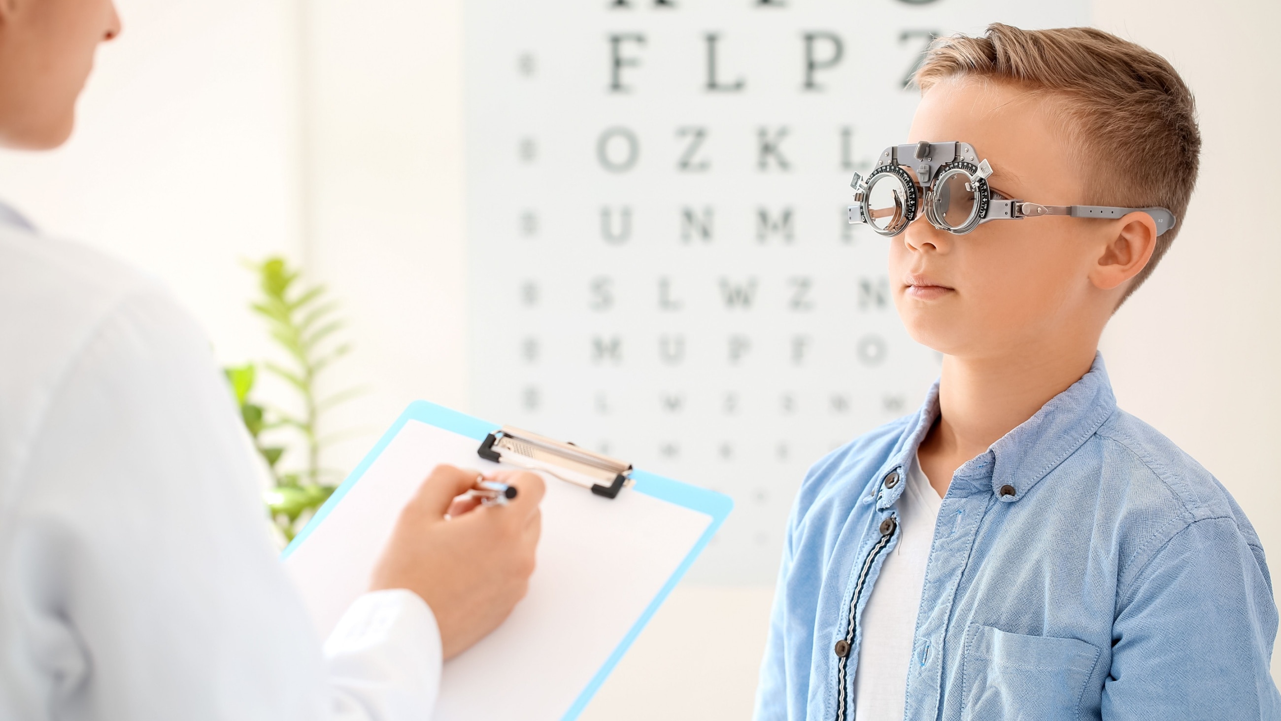 boy getting an eye exam with high myopia