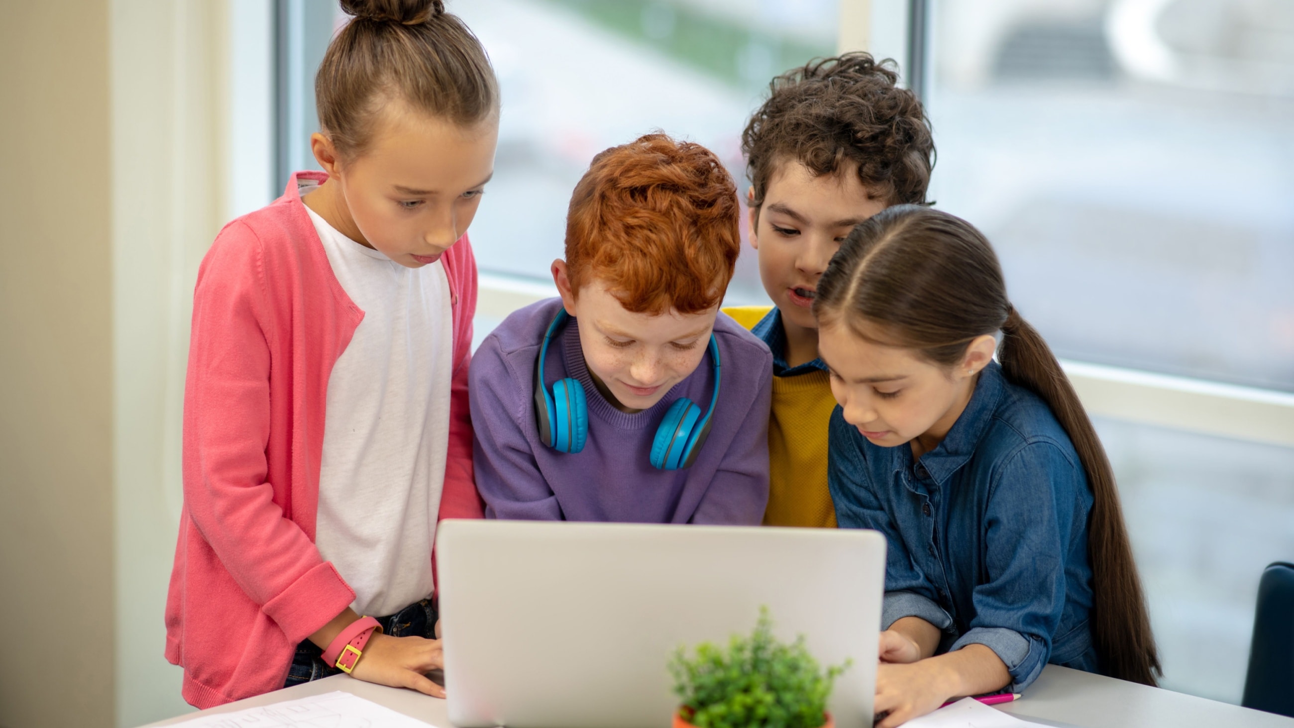 Children looking at a laptop screen