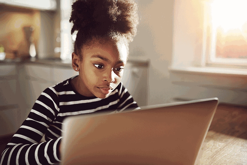 girl staring at computer screen
