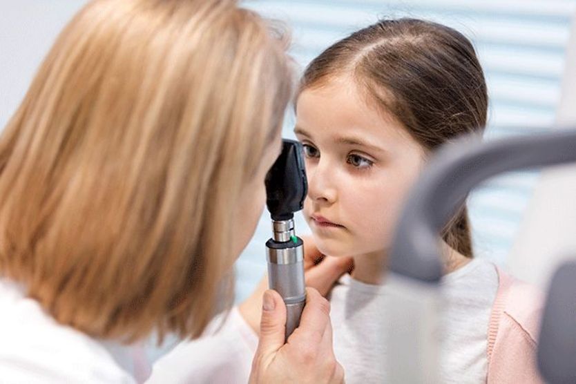girl with nystagmus getting eyes checked by eye doctor girl with nystagmus getting eyes checked by eye doctor