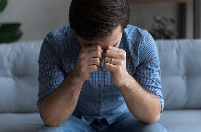 depressed man with vision loss experiencing mental health issues