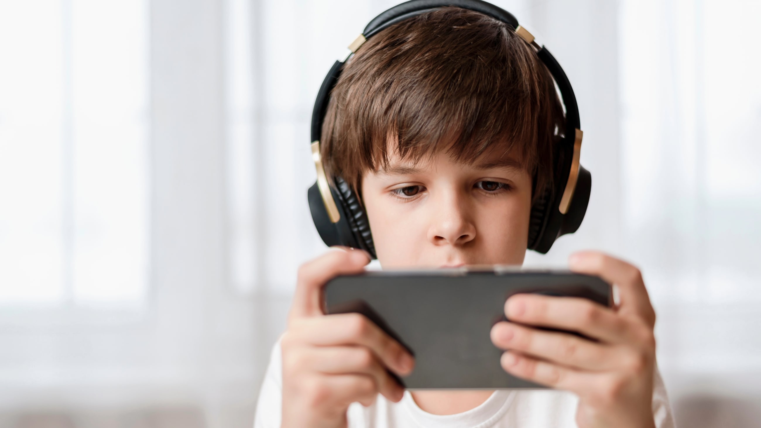 child playing game on tablet computer