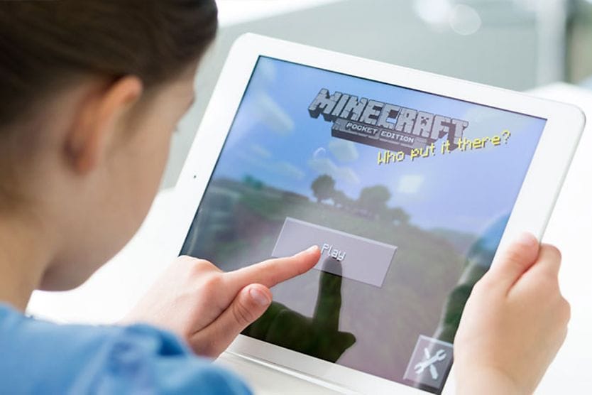 child playing game on tablet computer