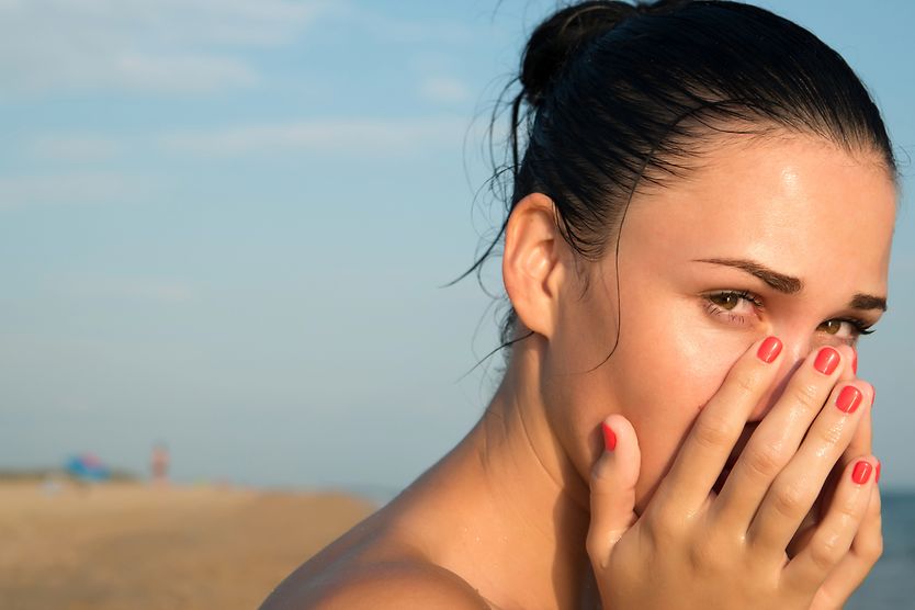 woman with ocular syphilis on the beach