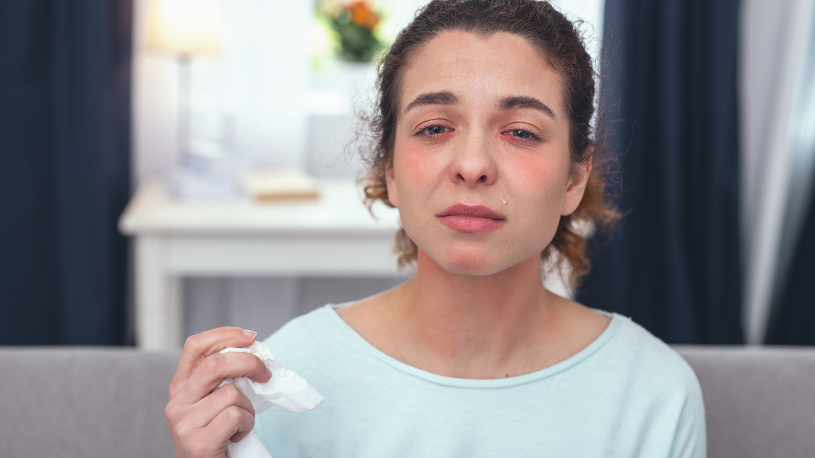 young woman with pink eye symptoms