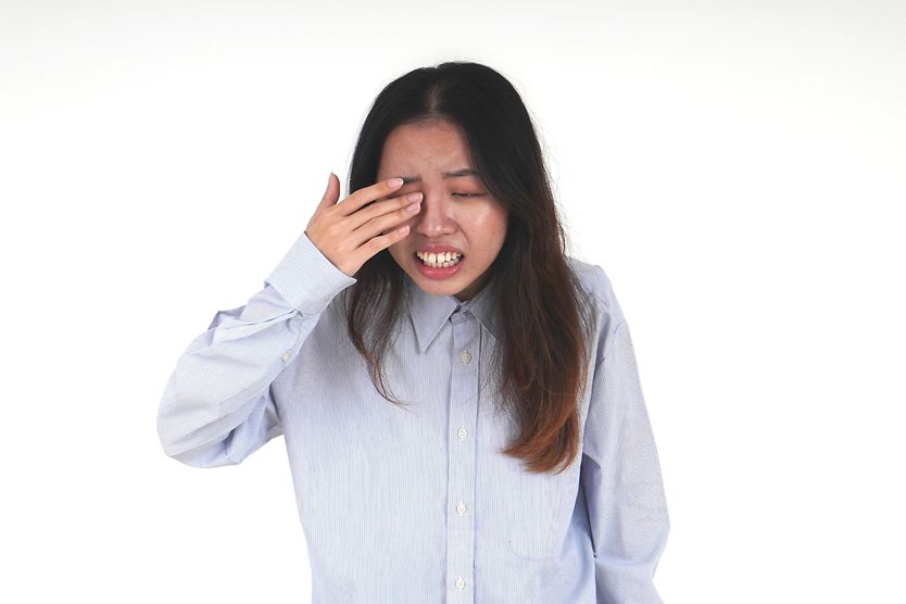 woman with something in her eye