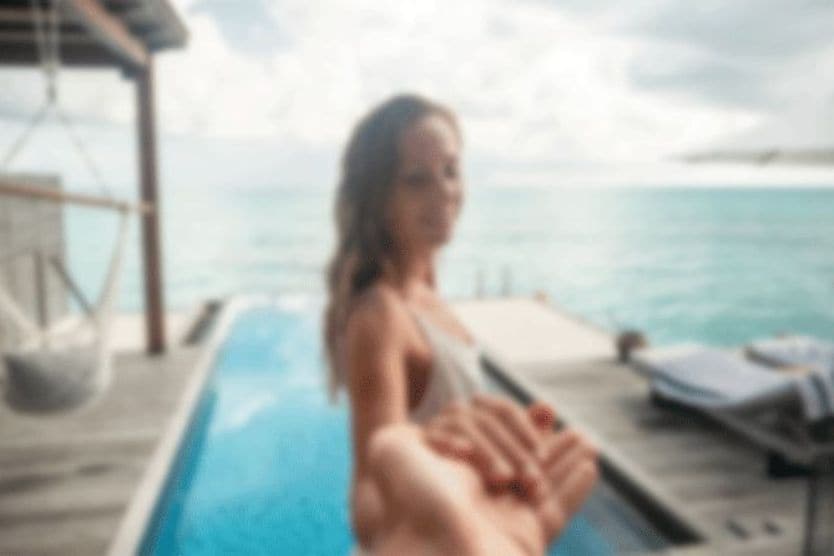 cloudy image of a woman by the pool cloudy image of a woman by the pool
