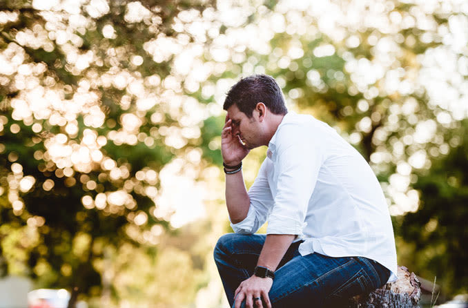 Man suffering from headache due to eye pain