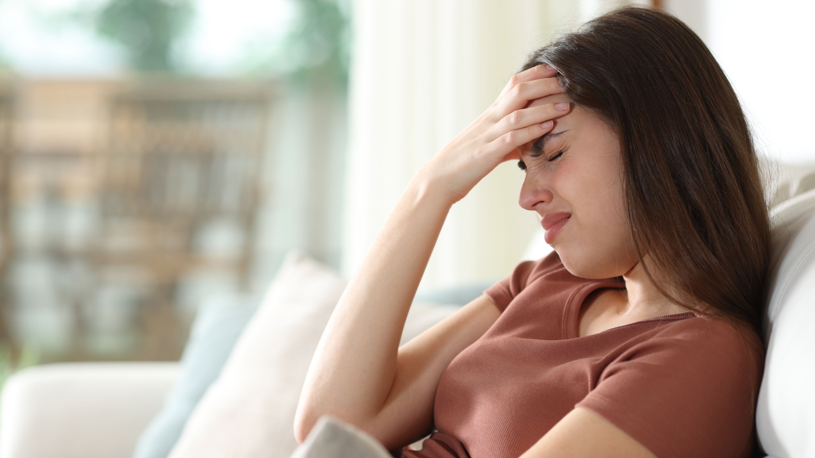 woman with a headache woman with a headache