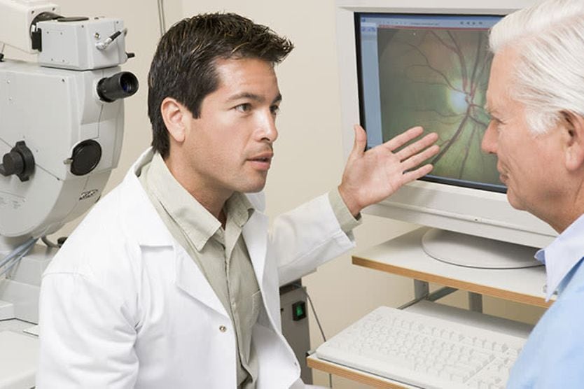 opthalmologist discussing eye floaters treatment with patient