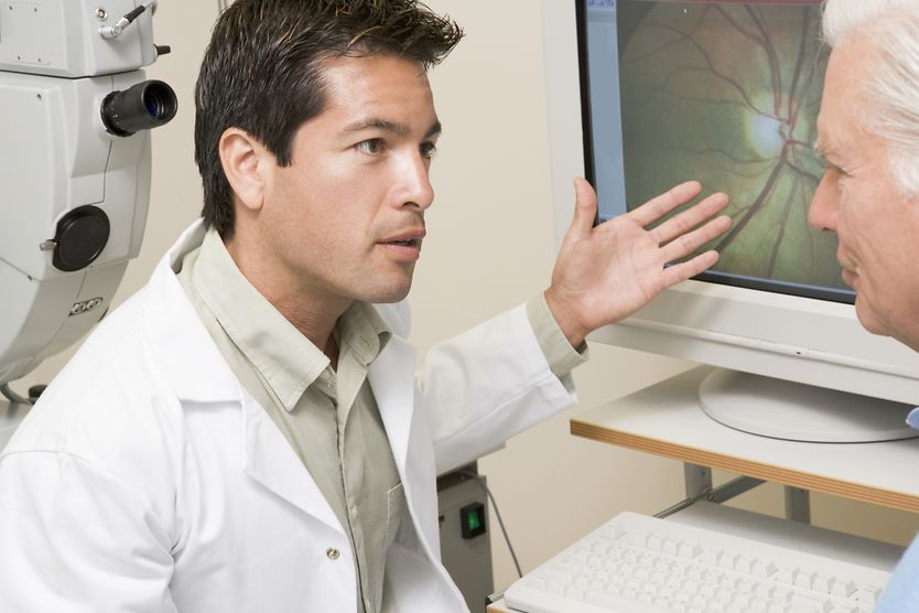 opthalmologist discussing eye floaters treatment with patient