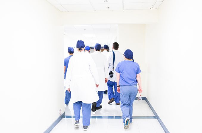 group of surgeons walking in hallway